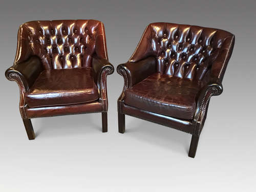Pair of leather upholstered club chairs