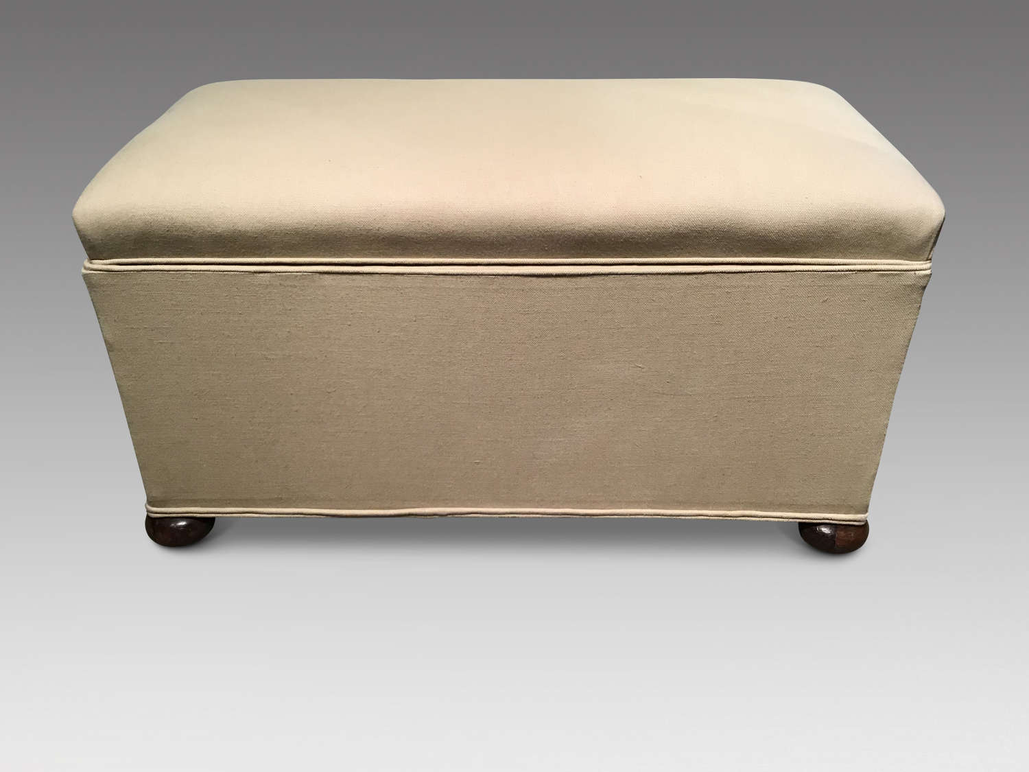 Antique upholstered ottoman