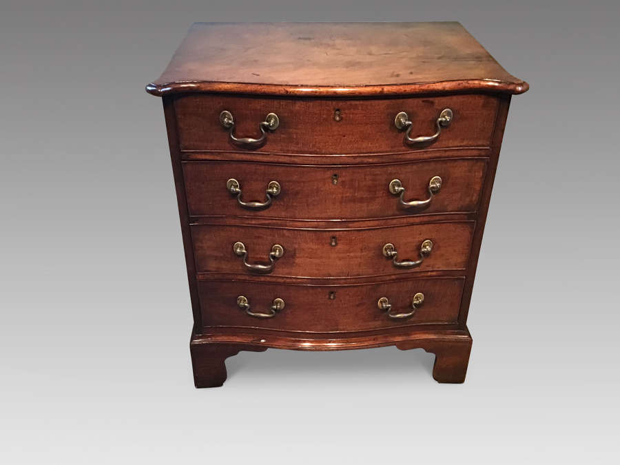 Antique mahogany serpentine chest of drawers