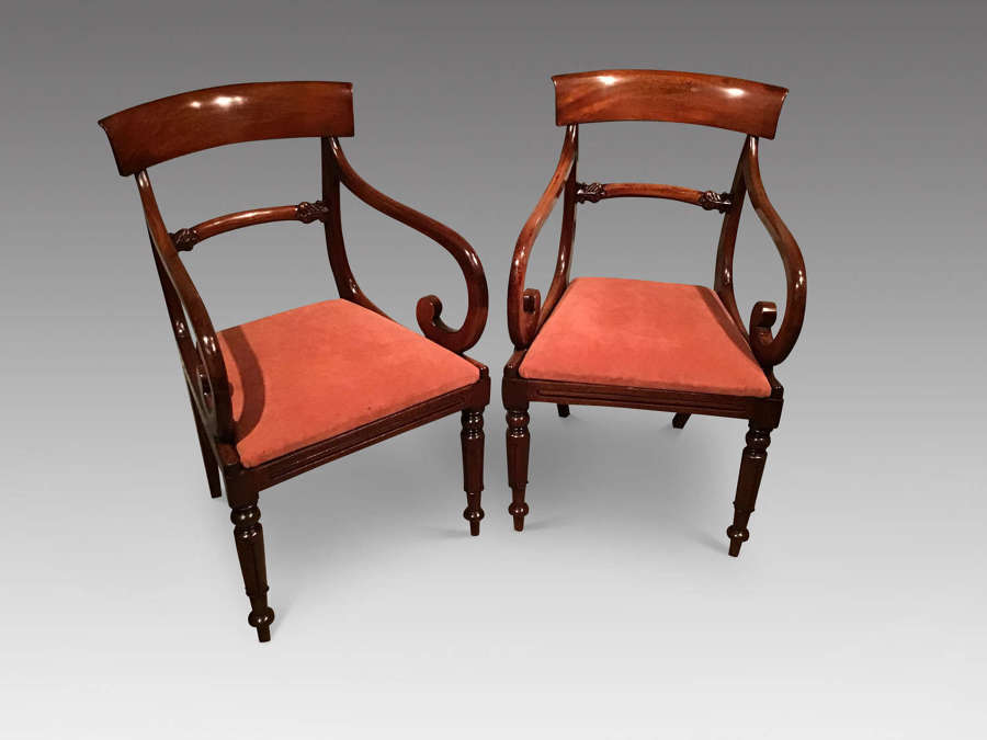 Pair of mahogany elbow chairs