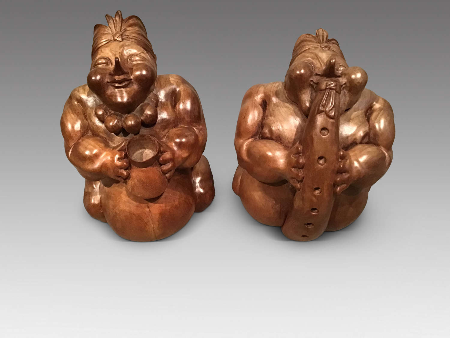 Pair antique carved wood figures