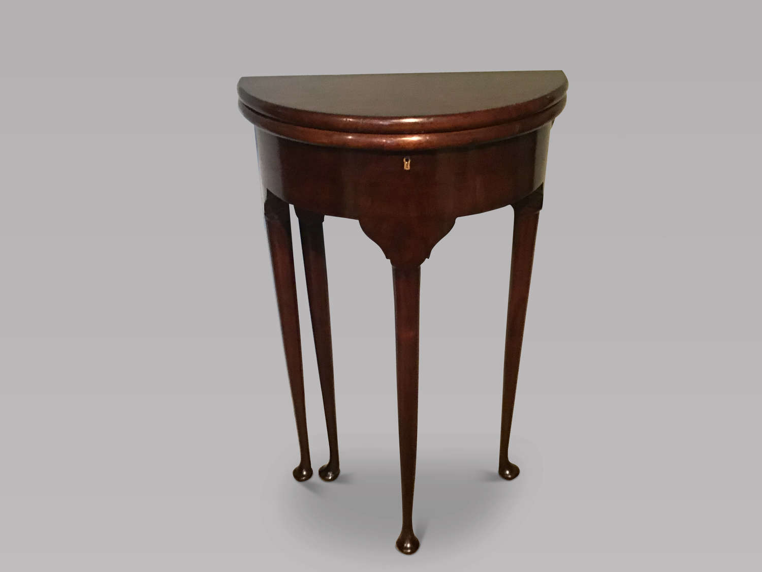 Antique mahogany demi lune table