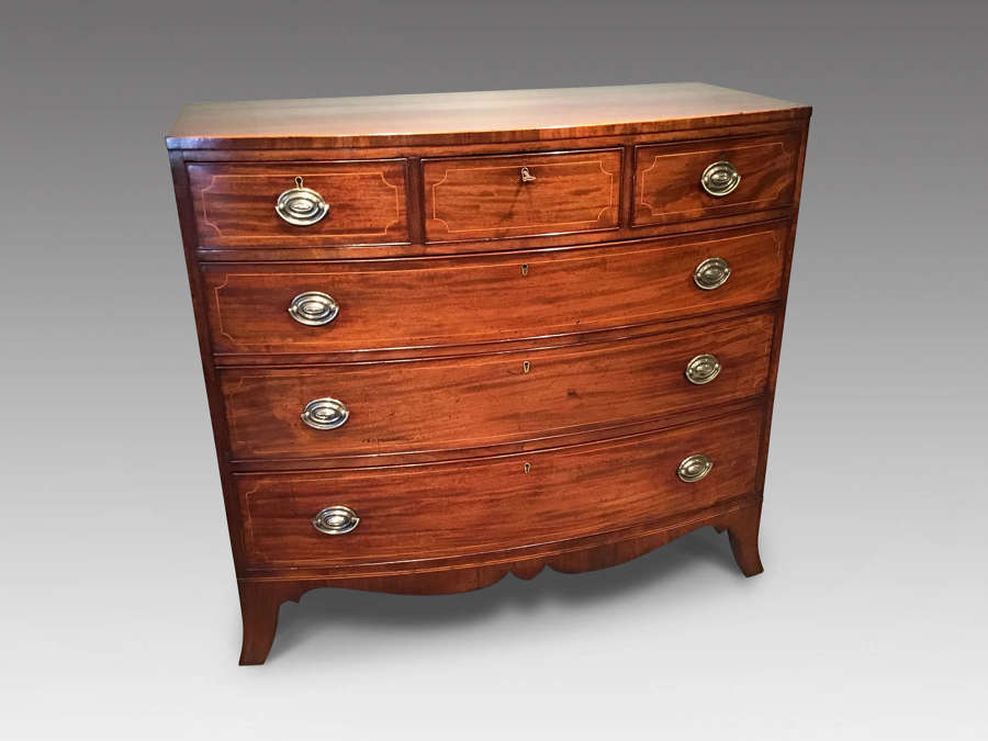 Antique bow front chest of drawers