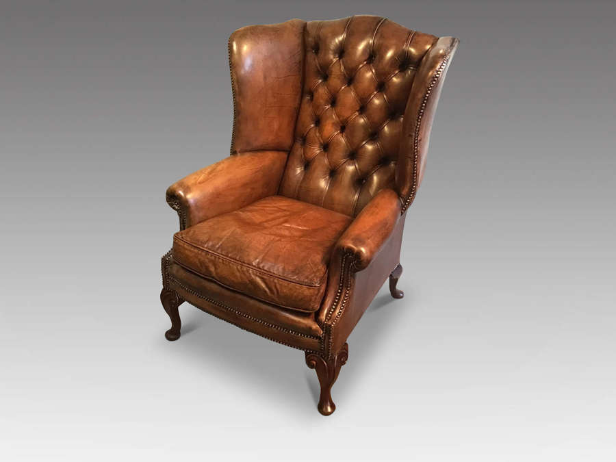 Antique leather wing chair