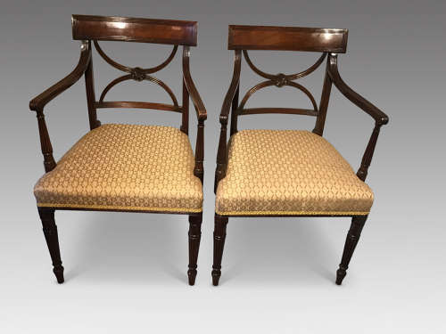 A pair of antique elbow chairs