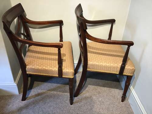 A pair of antique elbow chairs