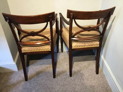 A pair of antique elbow chairs