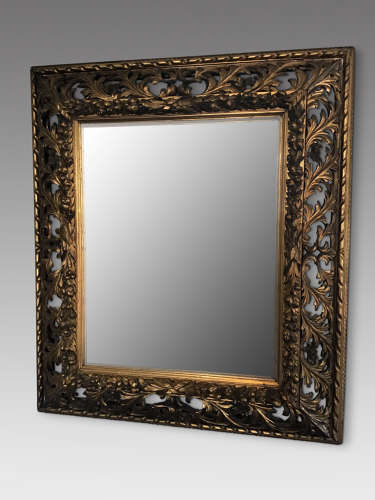 Carved giltwood wall mirror