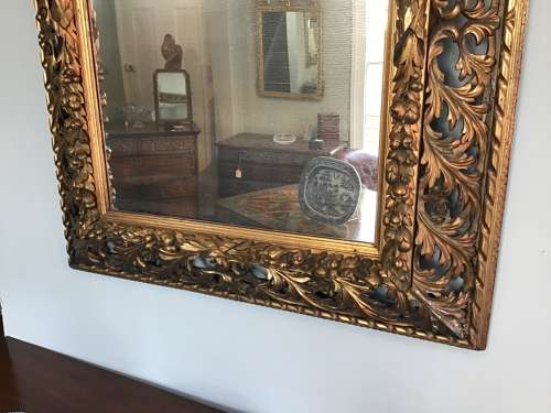 Carved giltwood wall mirror