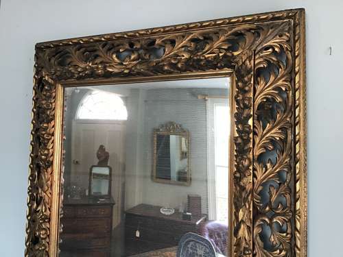 Carved giltwood wall mirror