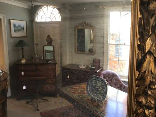 Carved giltwood wall mirror