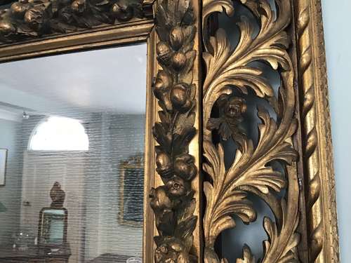 Carved giltwood wall mirror
