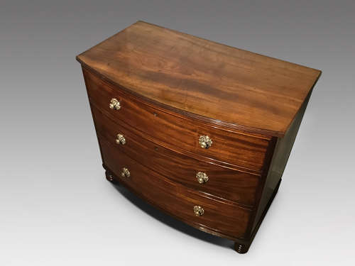 Antique bow chest of drawers