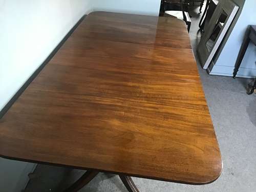 Antique mahogany pedestal dining table