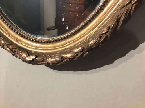 Antique oval gilt mirror