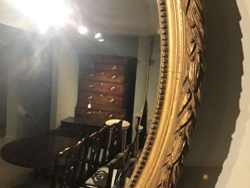 Antique oval gilt mirror