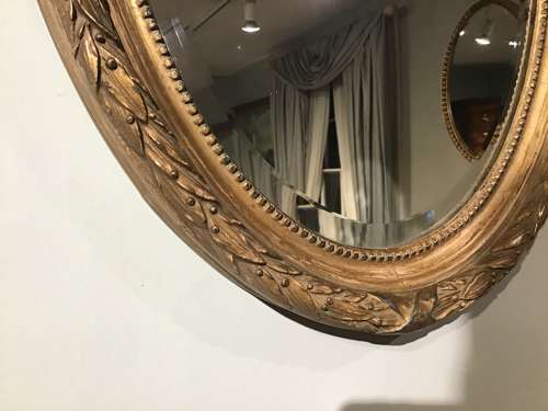 Antique oval gilt mirror