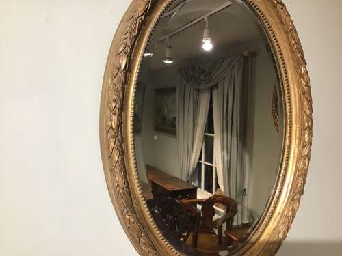 Antique oval gilt mirror