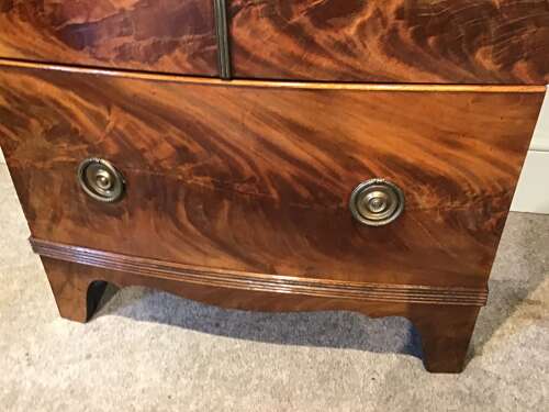 Antique bow front cabinet