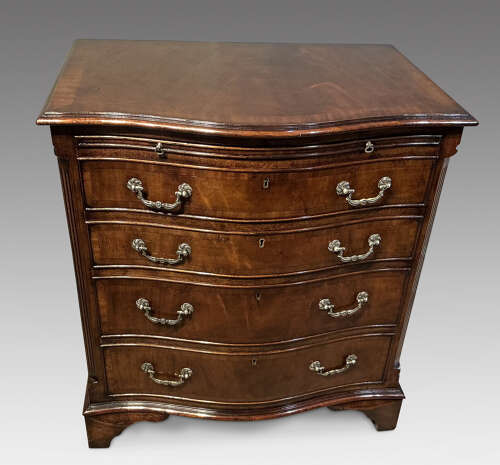 Antique mahogany serpentine chest of drawers.