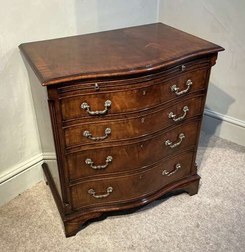 Antique mahogany serpentine chest of drawers.