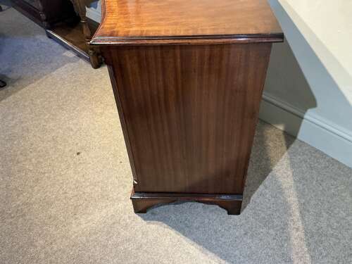 Antique mahogany serpentine chest of drawers.