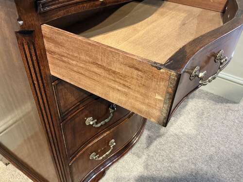 Antique mahogany serpentine chest of drawers.