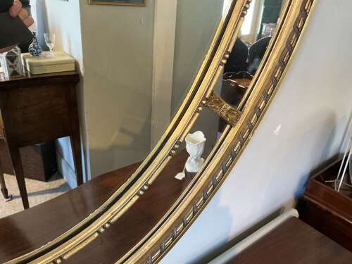 Antique oval gilt mirror.