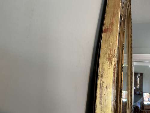 Antique oval gilt mirror.